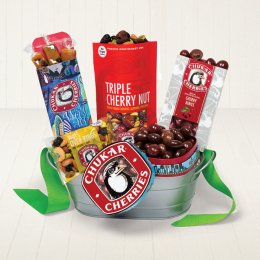 Market Goodies Gift Basket includes a bag of Triple Cherry Nut Mix, a box of Cherry Caramel Twists, box of Cherry Bings, Seattle Souvenir Box, and a bag of Nuts Over Bings all in a silver tin.